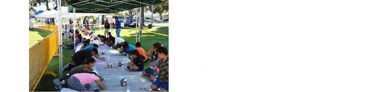Kids drawing on sidewalk with chalk