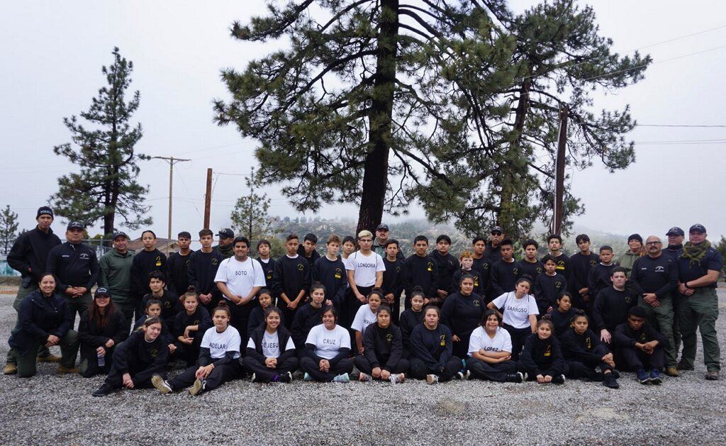 T.O.R.C.H. Group Photo Outside by Trees